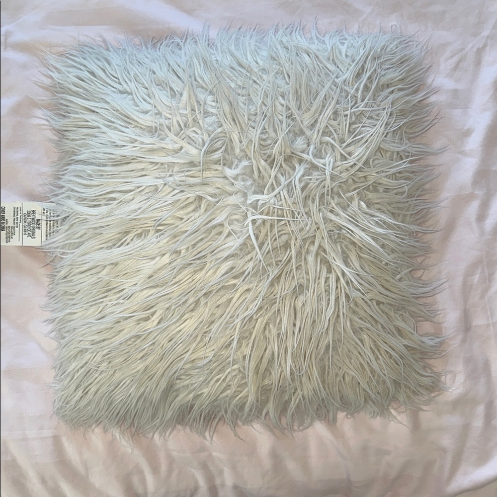 Fluffy white decorative pillow
